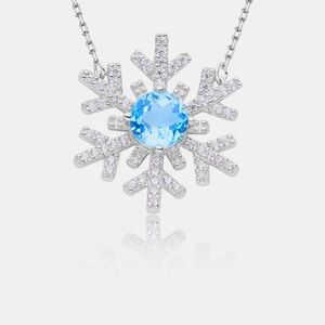 BOUTIQUE Elegant Winter Holiday Sterling Silver Snowflake Necklace, Blue Topaz